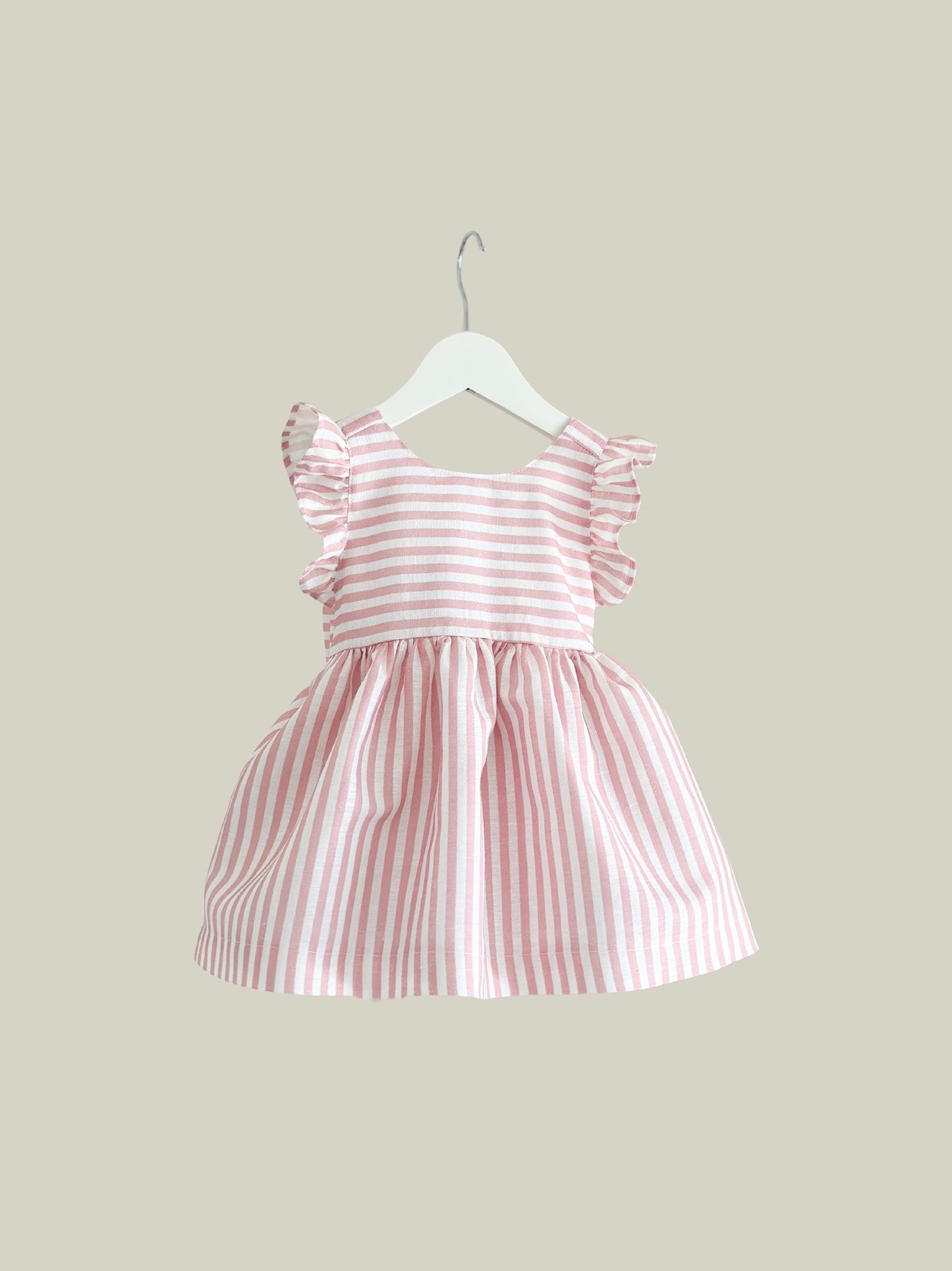 Dulci bow dress in striped blush linen