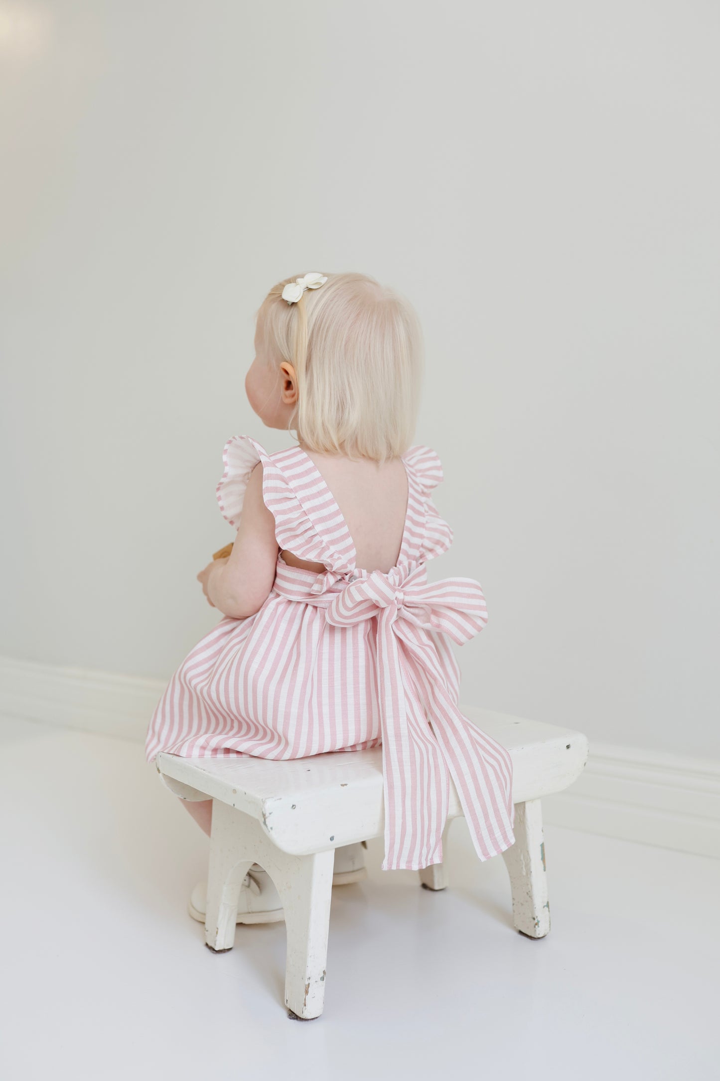 Dulci bow dress in striped blush linen